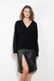 The Sage Sweater by Loulou Studio is an oversized sweater with an ample fit, a deep V, dropped shoulders and ribbed details