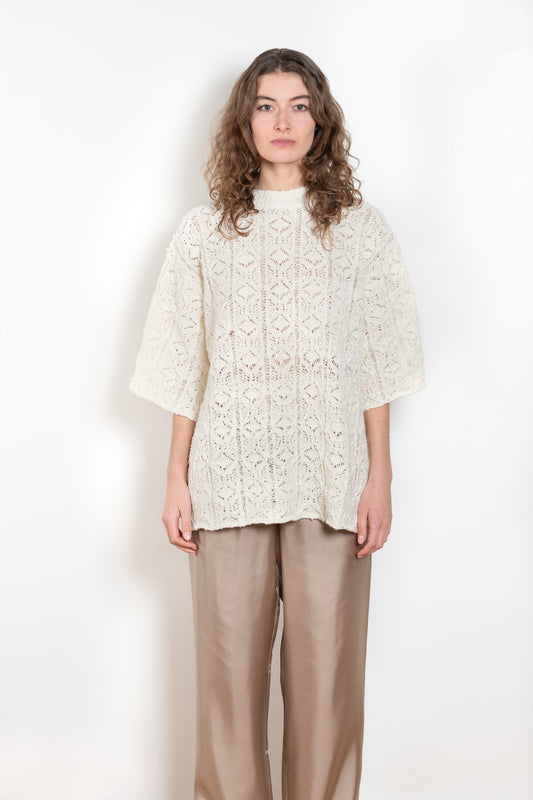 The Antila Top by Loulou Studio is a lace stitch top with a loose fit and wide short sleeves