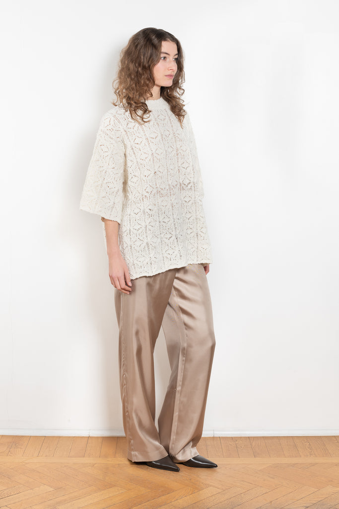 The Antila Top by Loulou Studio is a lace stitch top with a loose fit and wide short sleeves