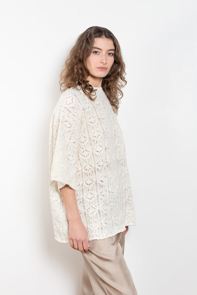 The Antila Top by Loulou Studio is a lace stitch top with a loose fit and wide short sleeves