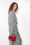 The Anzor Sweater by Loulou Studio has a slightly cropped ample fit with dropped shoulders and long sleeves in cashmere