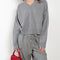 The Anzor Sweater by Loulou Studio has a slightly cropped ample fit with dropped shoulders and long sleeves in cashmere