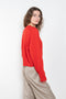 The Anzor Sweater by Loulou Studio has a slightly cropped ample fit with dropped shoulders and long sleeves in cashmere