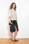 The Ekare Skirt by Loulou Studio is a mid waist slit skirt in a kine lambskin leather