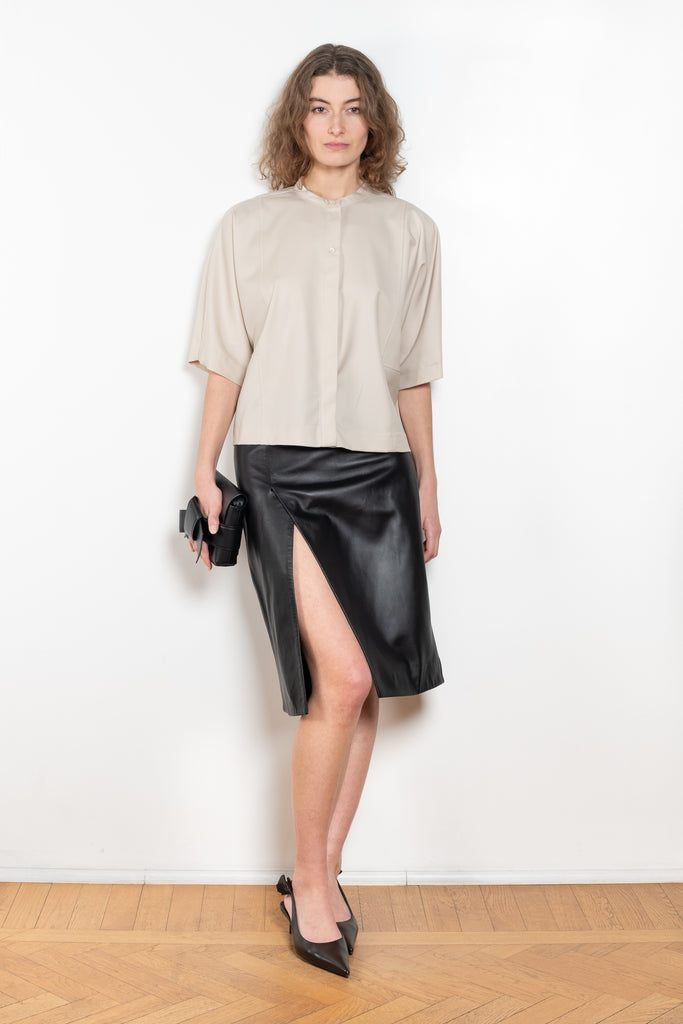 The Ekare Skirt by Loulou Studio is a mid waist slit skirt in a kine lambskin leather