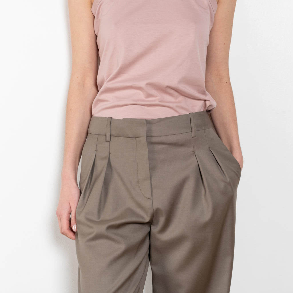 The Sbiru Pants by Loulou Studio are signature suiting paints that sit on the waist, are ample and pleated at the waist