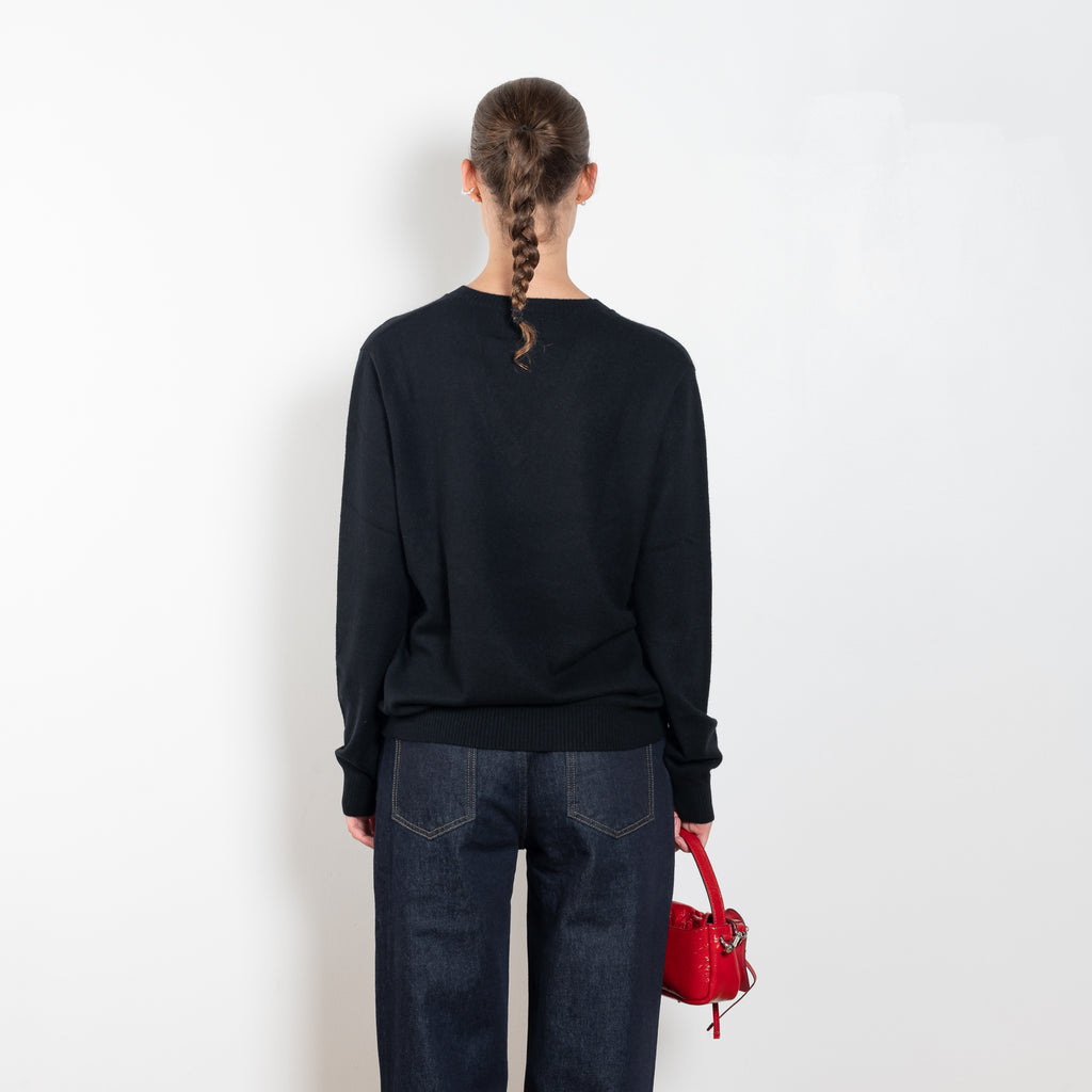 The Serafini Vneck by Loulou Studio is a loose V neck sweater in a soft cashmere