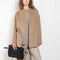 The Gio Coat by Loulou Studio is a round neck straight coat with minimal lines and an invisible closure 