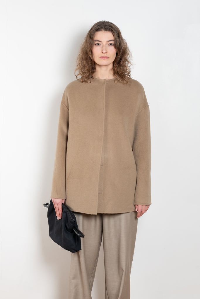 The Gio Coat by Loulou Studio is a round neck straight coat with minimal lines and an invisible closure 