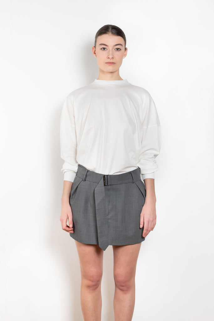 The Belted Mini Skirt by Magda Butrym is an ultra-short, low-waisted mini skirt with a belted waist, perfect for adding a touch of flair to any outfit