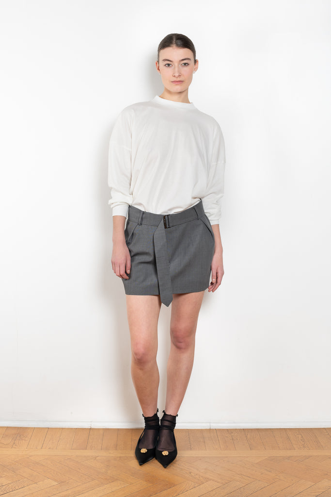 The Belted Mini Skirt by Magda Butrym is an ultra-short, low-waisted mini skirt with a belted waist, perfect for adding a touch of flair to any outfit