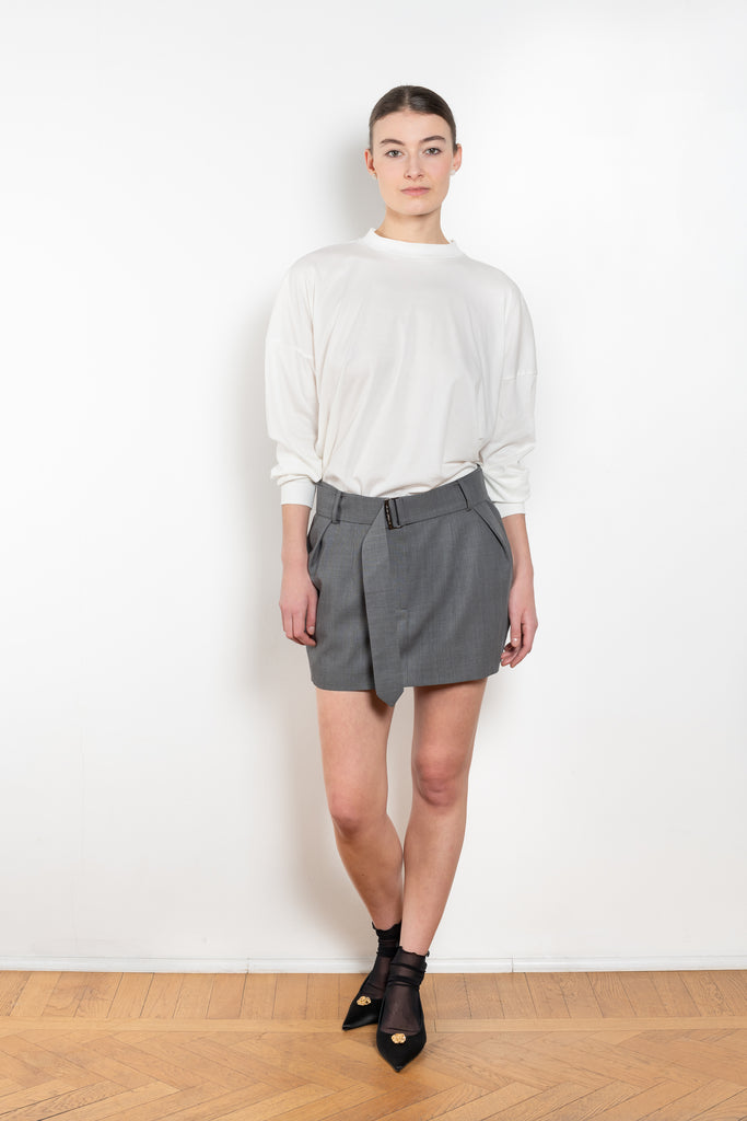 The Belted Mini Skirt by Magda Butrym is an ultra-short, low-waisted mini skirt with a belted waist, perfect for adding a touch of flair to any outfit