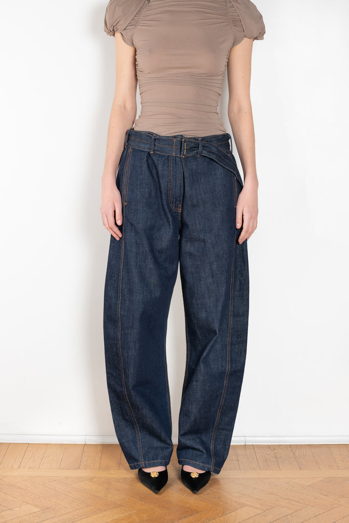 The Belted Loose Denim by Magda Butrym are loose-fit navy denim pants with a wide leg