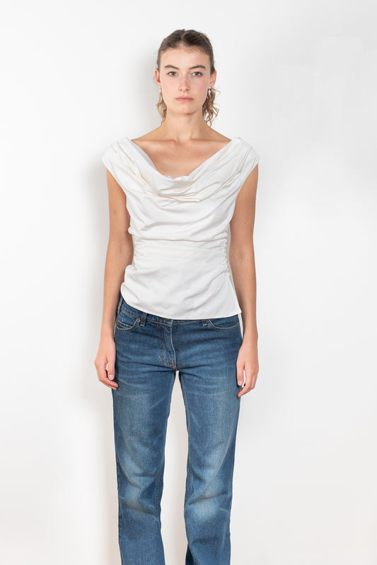 The Off Shoulder Draped Top by Magda Butrym is made from natural crinkle silk and has a draped wrap effect and side ruching down the body for an elegant fit