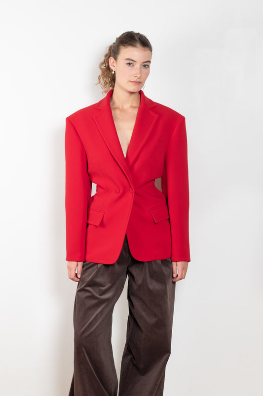 The Hourglass Blazer by Magda Butrym is an oversized hourglass blazer with boxy shoulders and an adjustable, cinched waist