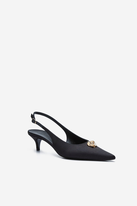 The Slingback Kitten Heels by Magda Butrym is a classic pointed-toe slingback kitten heel with a rosette embellishment at the front