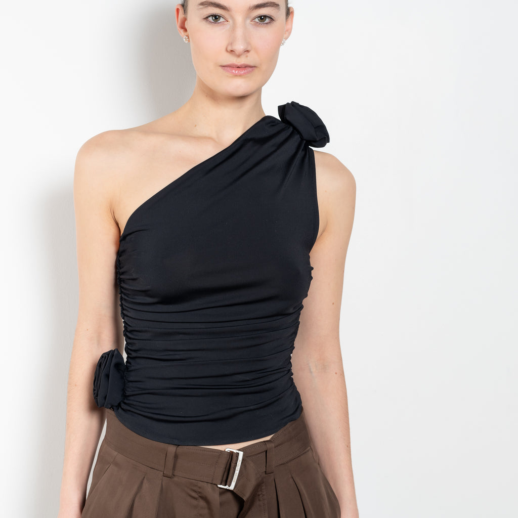 The Off Shoulder Top by Magda Butrym is a lightweight, one-shoulder asymmetrical top with ruched detailing and 3D roses