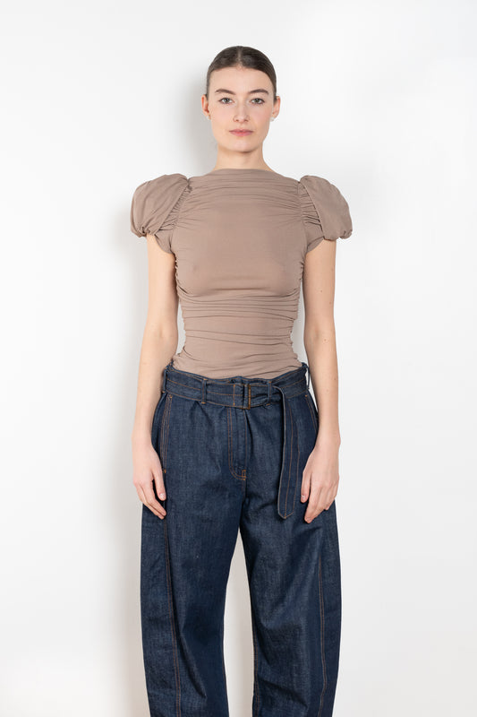 The Puff Sleeve Ruched Blouse by Magda Butrym is a stretch silk top with light ruching down the body and puffed cap sleeves