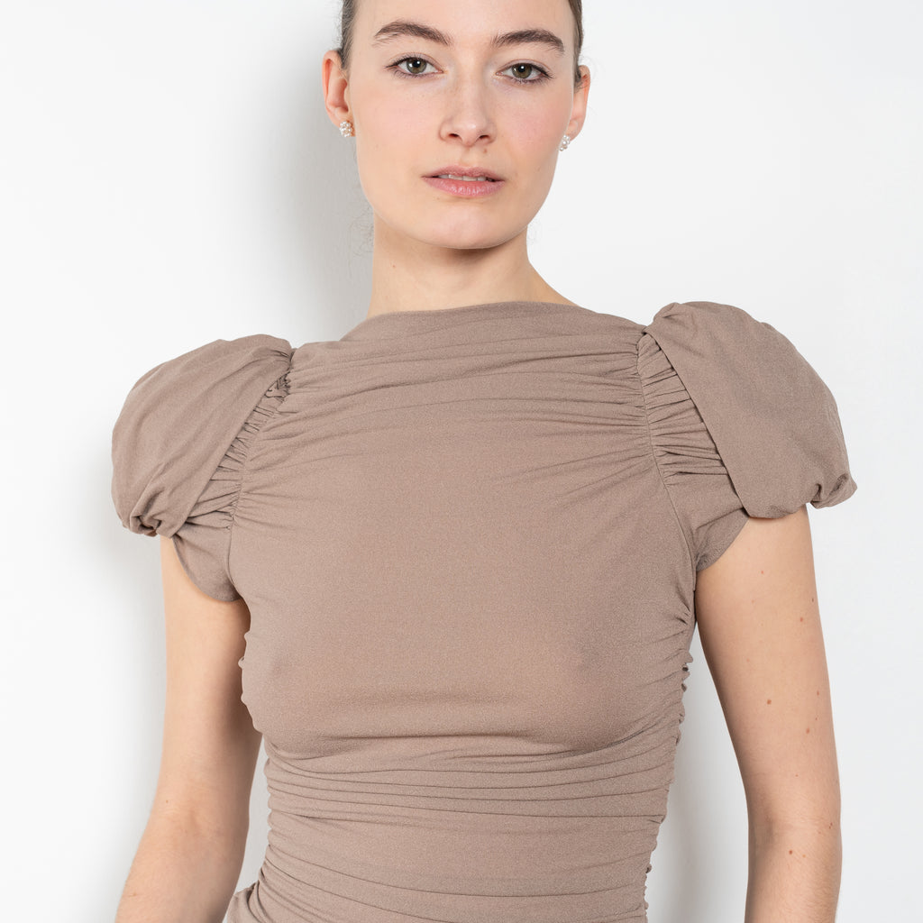 The Puff Sleeve Ruched Blouse by Magda Butrym is a stretch silk top with light ruching down the body and puffed cap sleeves