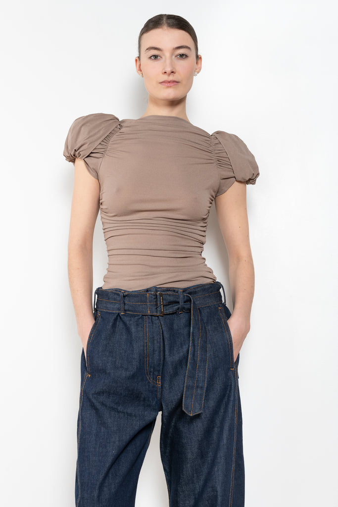 The Puff Sleeve Ruched Blouse by Magda Butrym is a stretch silk top with light ruching down the body and puffed cap sleeves