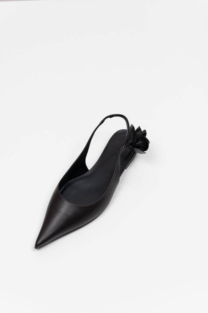 The Slingback Flats by Magda Butrym are classic pointed toe slingback flats with a small rosette embellishment at the heel. Made in Italy