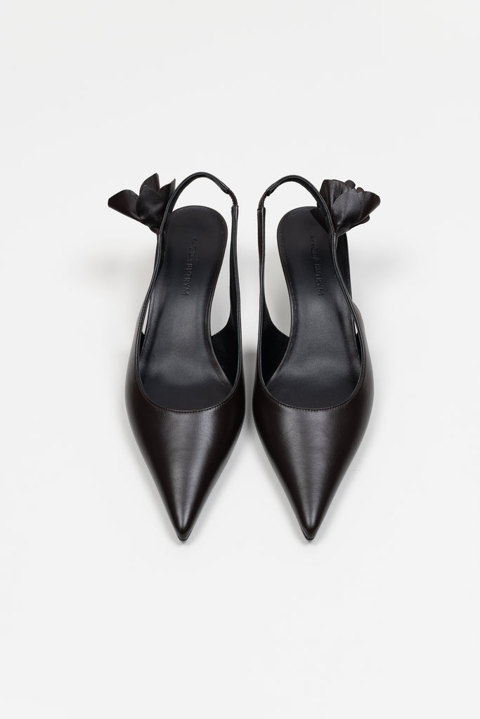 The Slingback Kitten Heels by Magda Butrym are classic pointed toe slingbacks with a small rosette embellishment at the heel. Kitten heels. Made in Italy