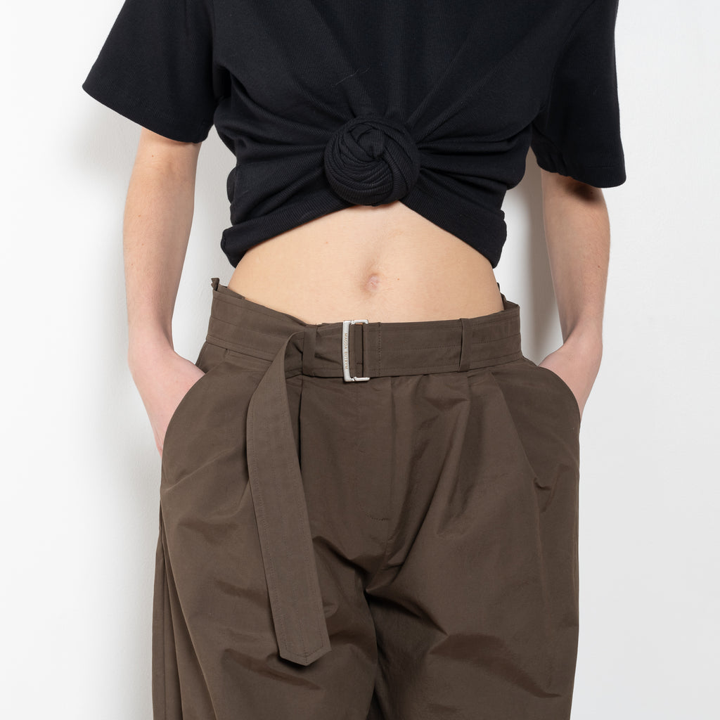 The Belted Relaxed Trouser by Magda Butrym are loose-fitting cotton trousers with front and back pockets, combining luxury with an easygoing, relaxed fit