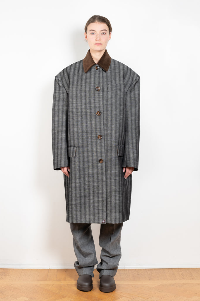 The Corduroy Collar Coat by Meryll Rogge is an oversized cotton coat with an exaggerated shoulder line and a corduroy collar