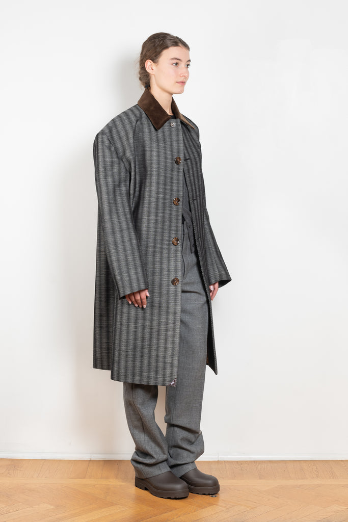 The Corduroy Collar Coat by Meryll Rogge is an oversized cotton coat with an exaggerated shoulder line and a corduroy collar