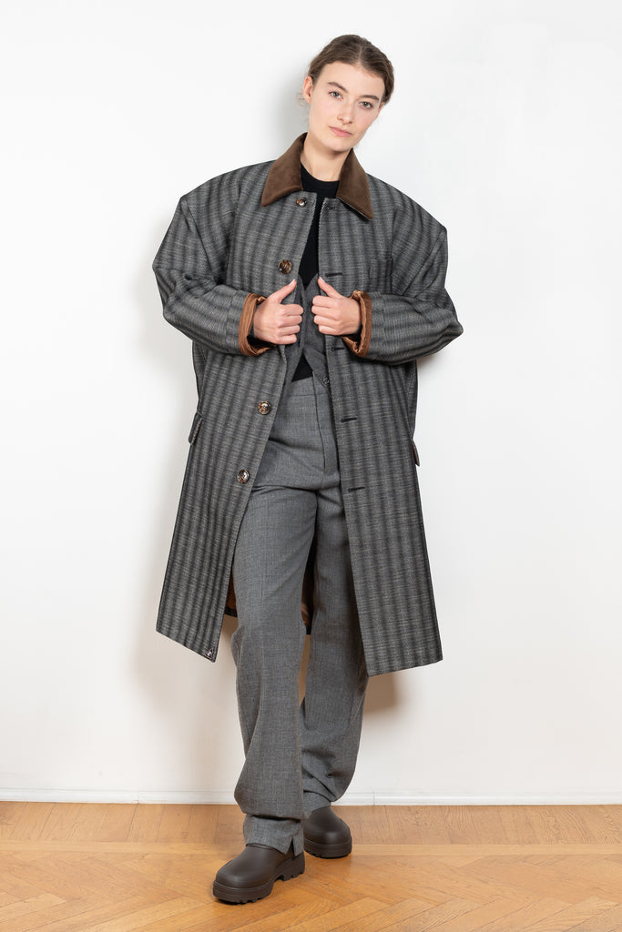 The Corduroy Collar Coat by Meryll Rogge is an oversized cotton coat with an exaggerated shoulder line and a corduroy collar