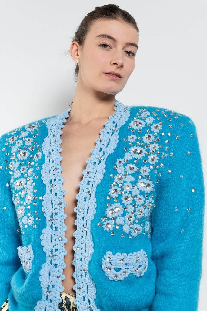 The Crochet Embellished Cardigan by Meryll Rogge is a showstopping runway piece, a padded cardigan in a blue mohair with embellished & crochet details