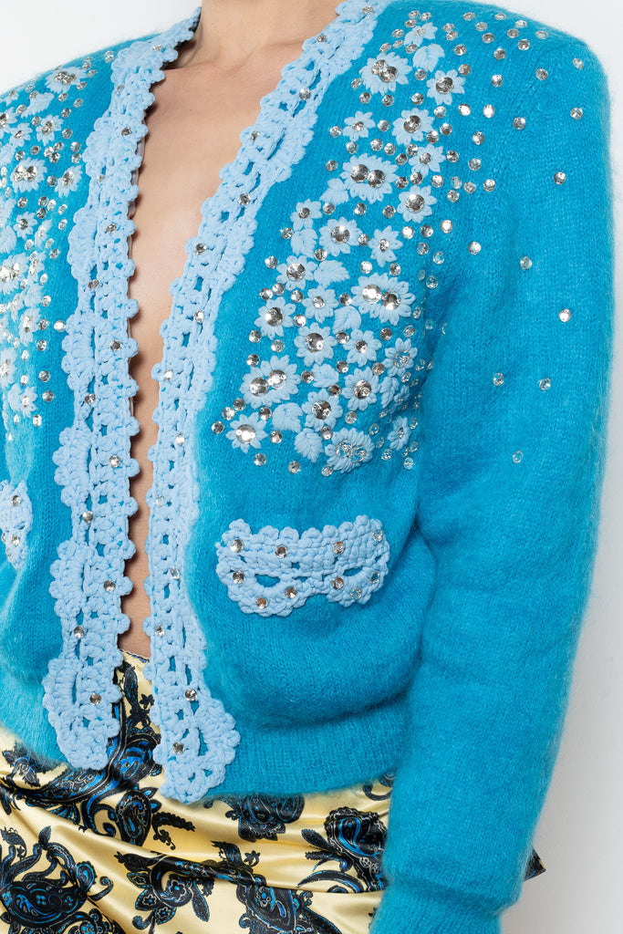 The Crochet Embellished Cardigan by Meryll Rogge is a showstopping runway piece, a padded cardigan in a blue mohair with embellished & crochet details