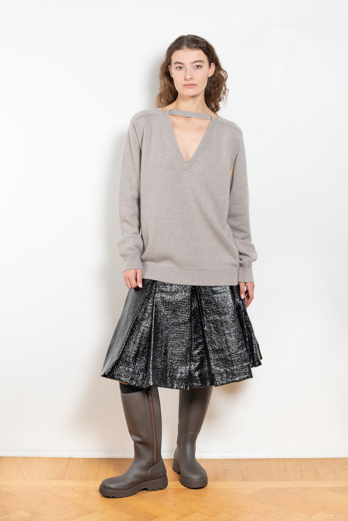 The Cut-out Vneck Sweater by Meryll Rogge is an oversized cashmere sweater with cut-outs at the arms and a deconstructed neckline which can be worn back or front