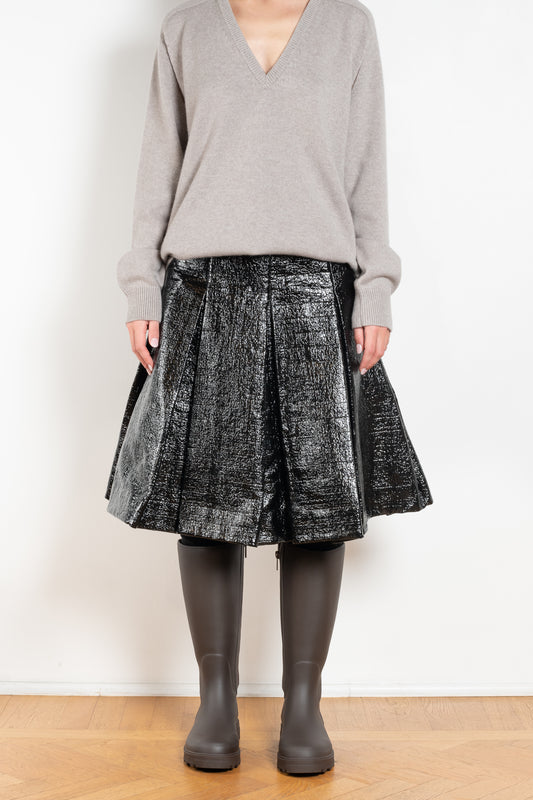 The Lacquered Pleated Skirt by Meryll Rogge is mid waist pleated skirt in lacquered coated cotton