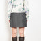 The Tailored Skirt by Meryll Rogge is a high waisted tailored mini skirt with front flap pockets