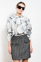 The Tailored Skirt by Meryll Rogge is a high waisted tailored mini skirt with front flap pockets