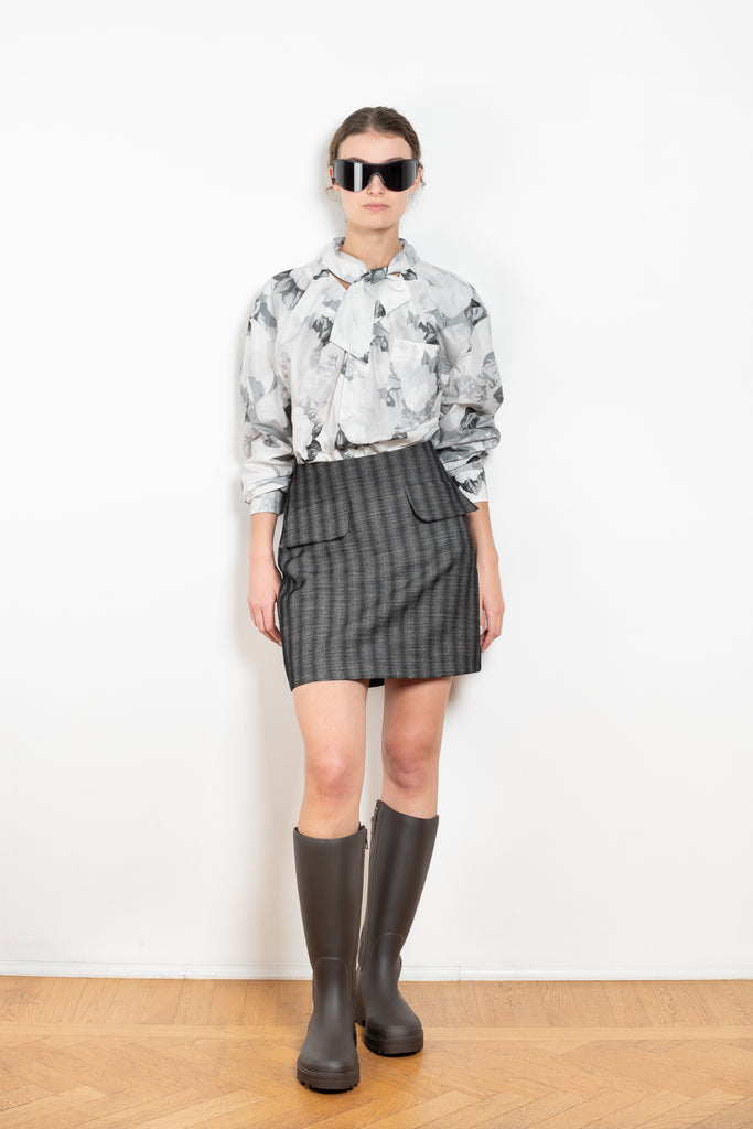 The Tailored Skirt by Meryll Rogge is a high waisted tailored mini skirt with front flap pockets