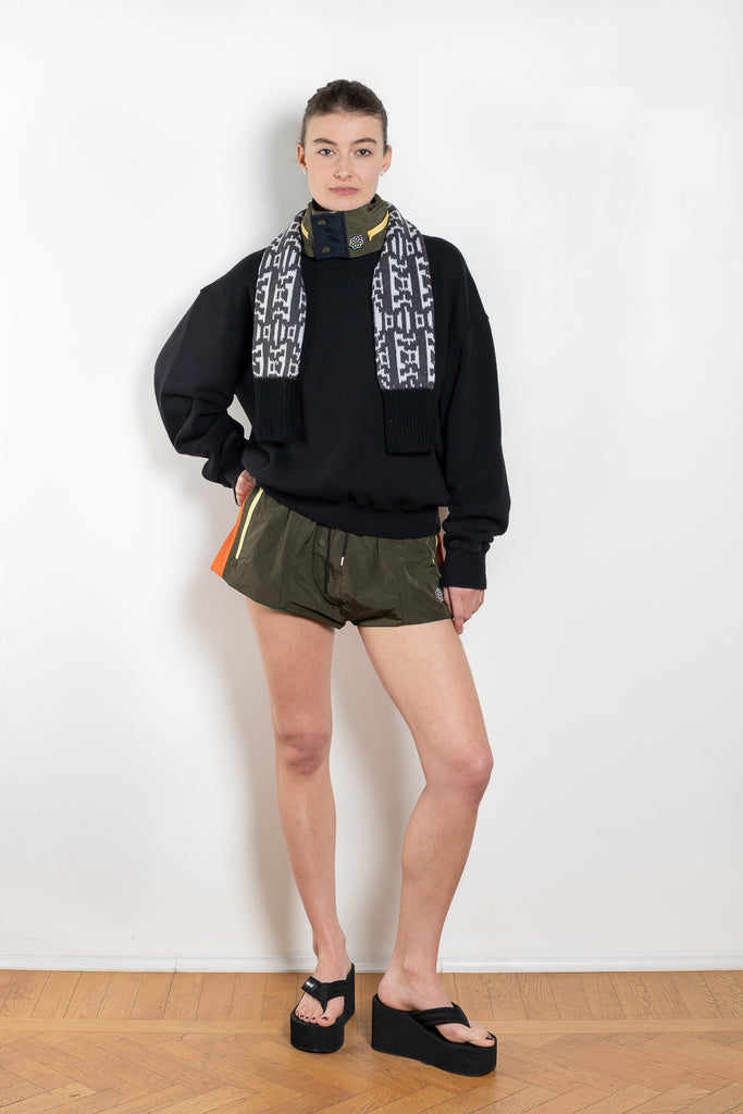 The Track Shorts by Meryll Rogge is a nylon mini short with track and color block detailing