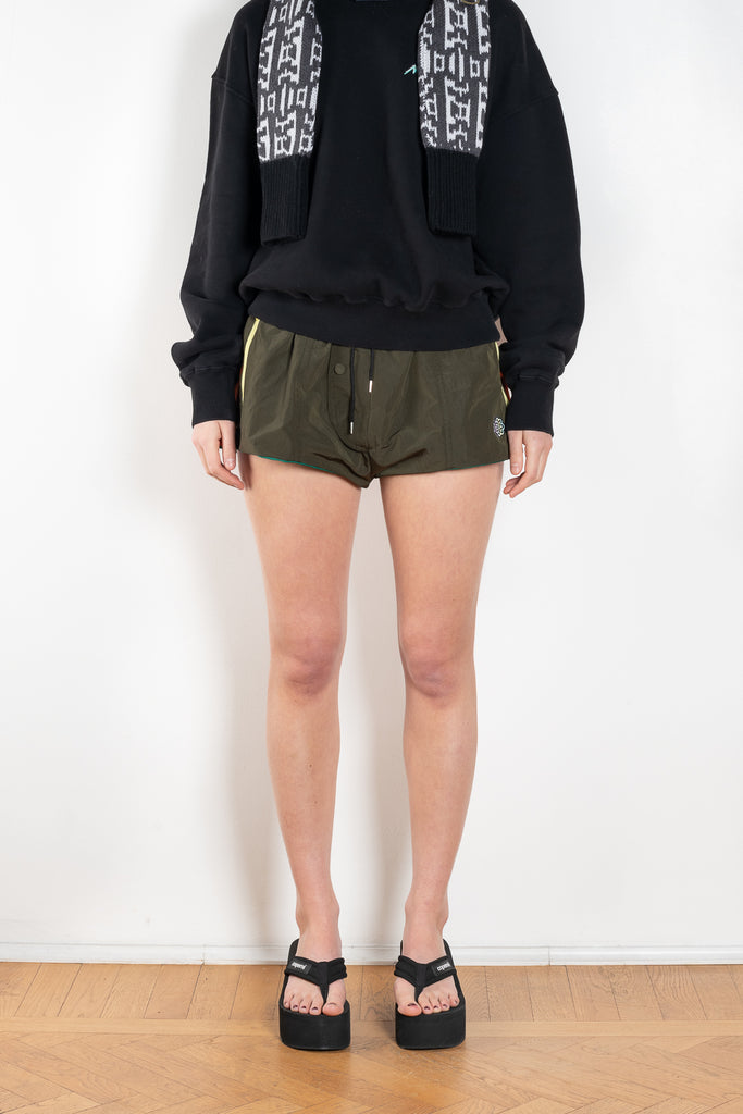 The Track Shorts by Meryll Rogge is a nylon mini short with track and color block detailing