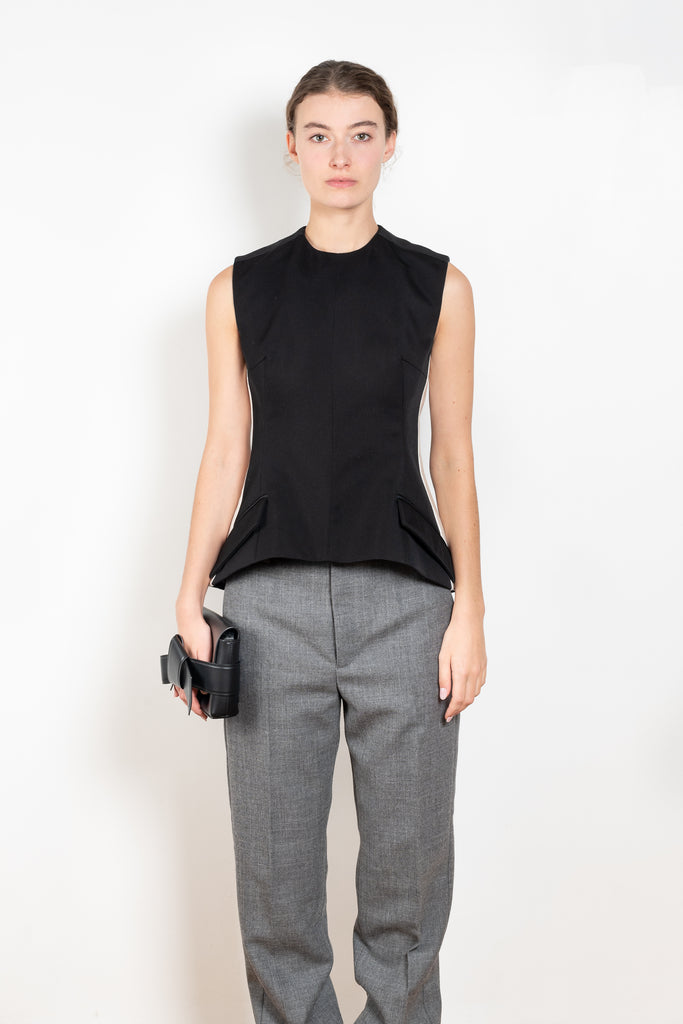 The Tuxedo Top by Meryll Rogge is structured sleeveless top with button detailing on the back and a tuxed band