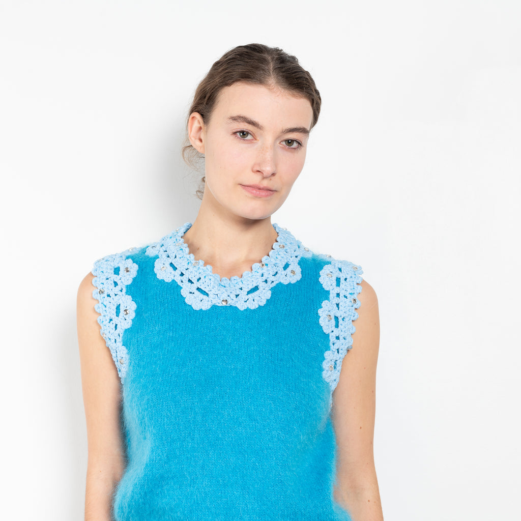 The Crochet Vest by Meryll Rogge is a showstopping runway piece, a sleeveless vest in a blue mohair with embellished crochet details