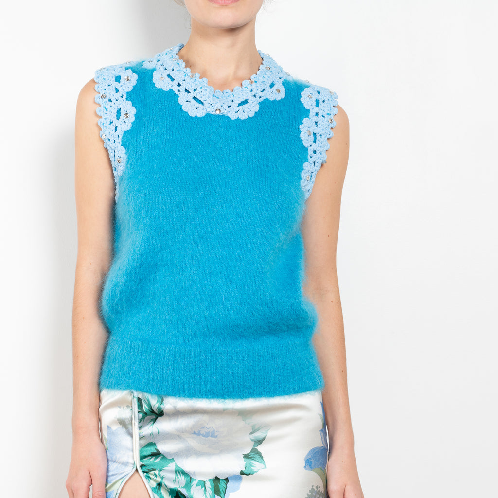 The Crochet Vest by Meryll Rogge is a showstopping runway piece, a sleeveless vest in a blue mohair with embellished crochet details