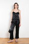 The Ruffle Pant by Meryll Rogge is a low waist trouser wit a drawstring closure and a ruffle hem