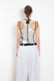 The Plexi Vest with Piping by Meryll Rogge is a ligthweight plexi vest with contrasted black piping and buttons