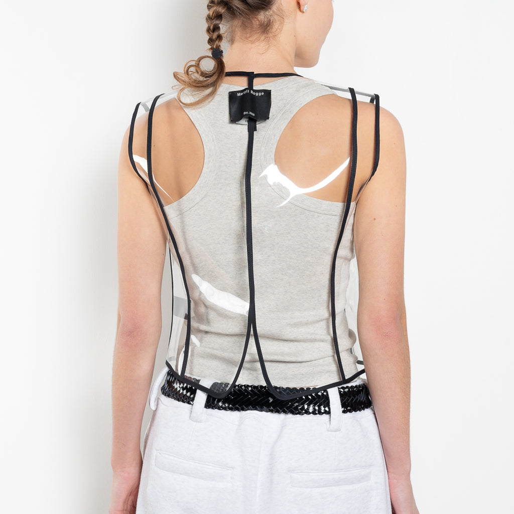 The Plexi Vest with Piping by Meryll Rogge is a ligthweight plexi vest with contrasted black piping and buttons