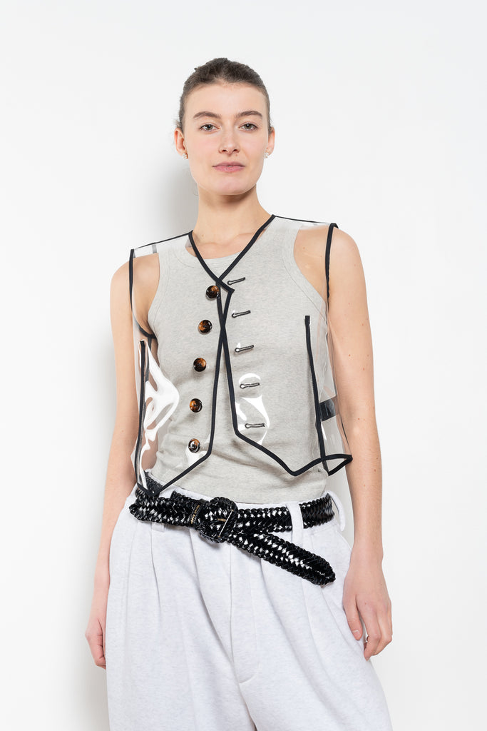 The Plexi Vest with Piping by Meryll Rogge is a ligthweight plexi vest with contrasted black piping and buttons