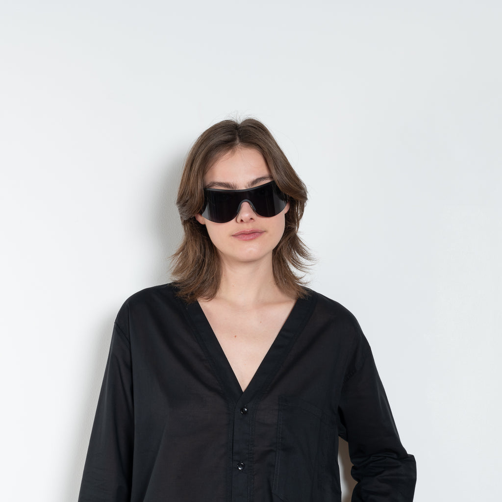 The V Shirt by Monique Van Heist is a loose fitted shirt with baseball inspired details