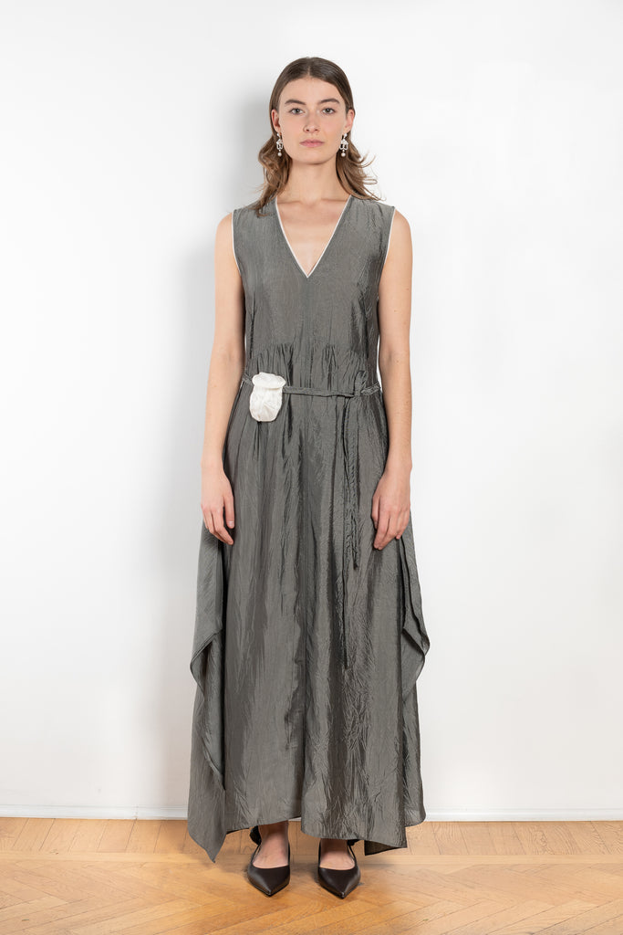 The Cyclamen Dress by Nackiye is an elegant sleeveless dress with a handkerchief detail on the skirt
