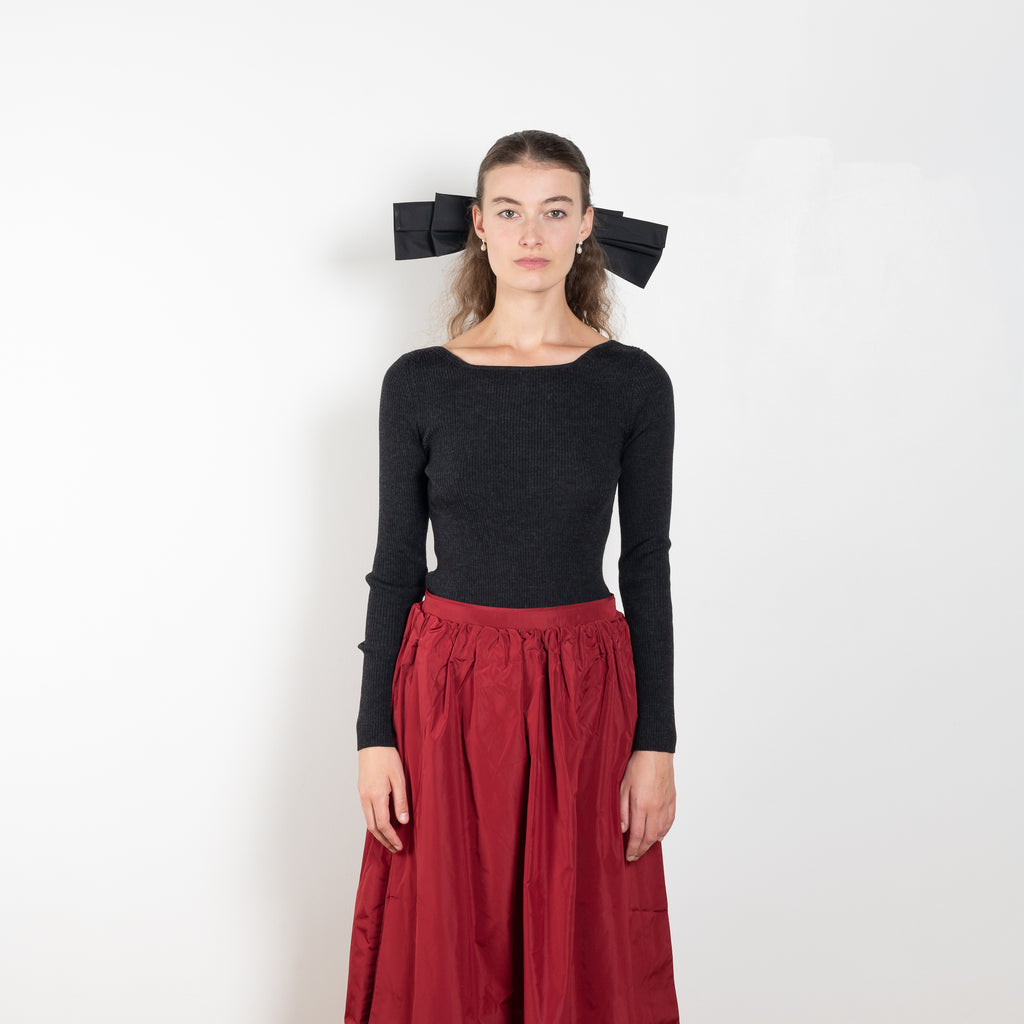 The Dancer Knit Top by Nackiye is a fine rib top with an open back and grosgrain bow ties on the back