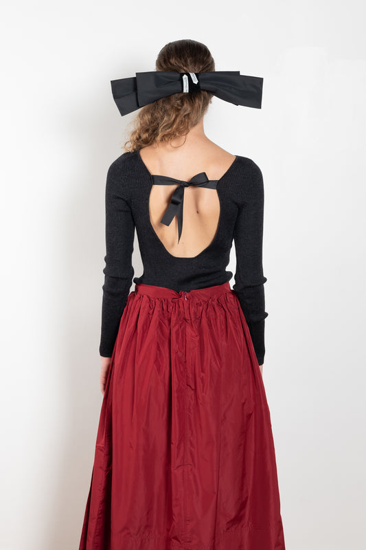 The Dancer Knit Top by Nackiye is a fine rib top with an open back and grosgrain bow ties on the back